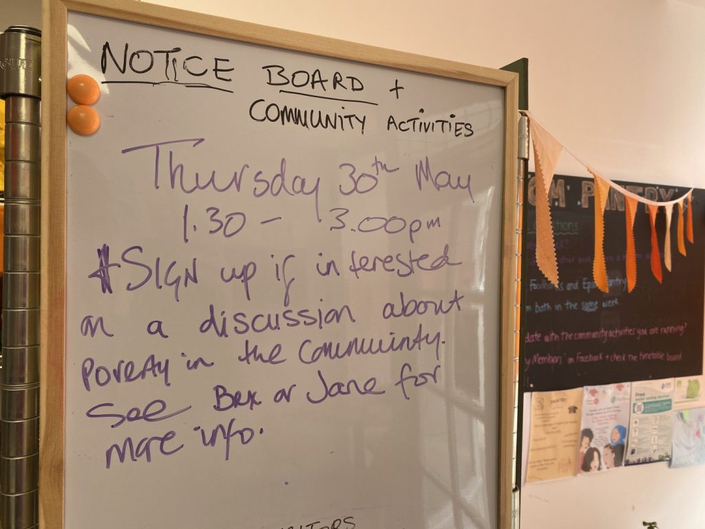 A whiteboard notice publicising the Epsom Neighbourhood Voices event