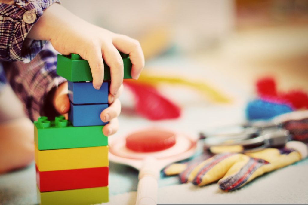 Child playing with building blocks