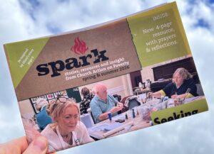 A folded copy of our Spark magazine