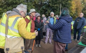 An unposed picture of a group of people preparing for a walk
