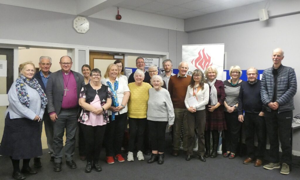 A posed group shot of about 20 people